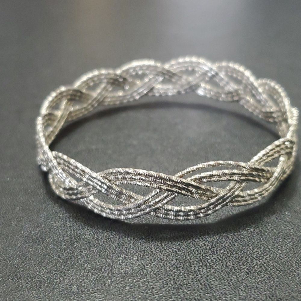 Silver tone braided bangle bracelet 7.75"